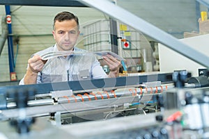 man looking at copy from professional printing works