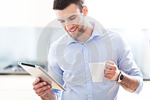 Man looking at digital tablet