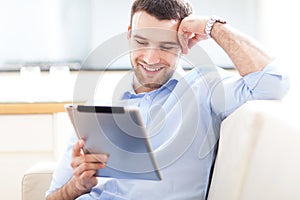 Man looking at digital tablet