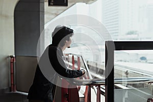 Man looking at the distance on skytrain
