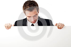 Man looking down at billboard