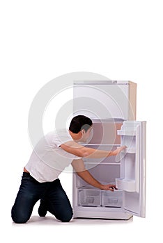 The man looking for food in empty fridge