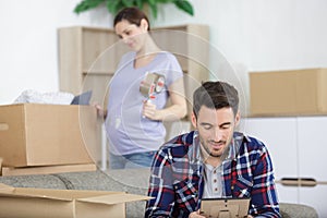 Man looking at frame while unpacking