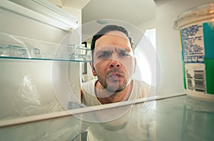 Man looking into the fridge