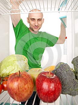 Man looking in fridge