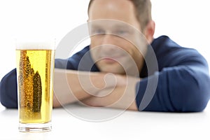 Man Looking At Glass Of Beer