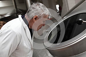 Man looking through the hatch of the tank