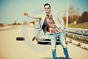 Man looking for help after a car breakdown