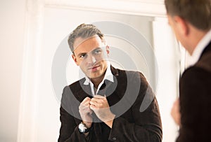 Man looking at himself in mirror