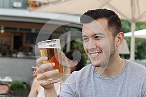 Man looking at his cold refreshing beer