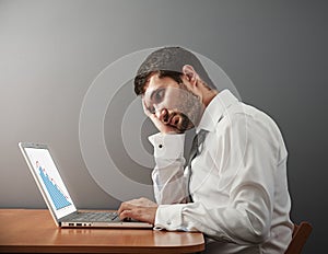 Man looking at his laptop