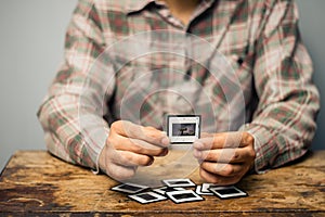 Man looking at his old slides