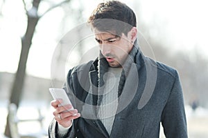 Man looking on his smartphone