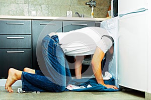 Man Looking inside the washing machine