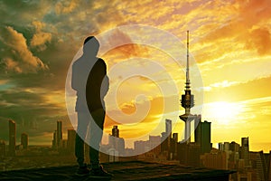 Man looking at kuwait city skyline photo