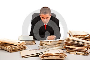 Man looking at lots of documents