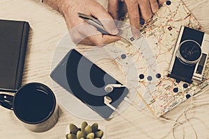 Man looking a map on a table