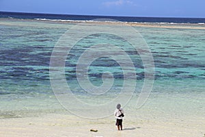 Man looking at the ocean