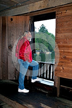 Man looking out doorway of Watsons Mill covered br