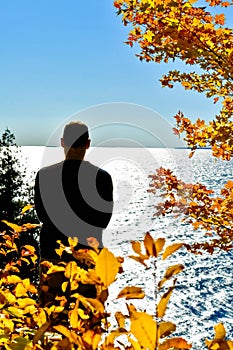 Man Looking Out Over Ellison Bay in Door County, WIsconsin photo