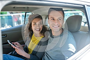 Man looking out the window and woman in car