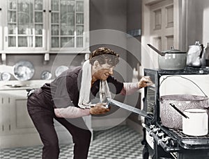 Man looking into oven