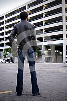 Man looking at parking garage