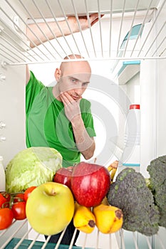 Man Looking into Refrigerator
