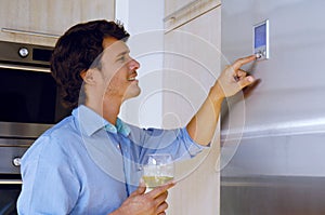 Man looking on refrigerator