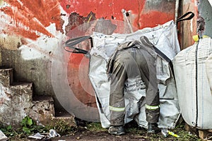 The man looking through rubbish