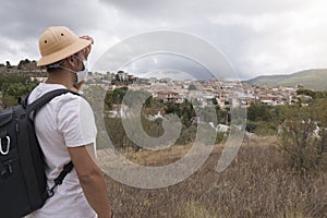 Man looking at scenic view village photo
