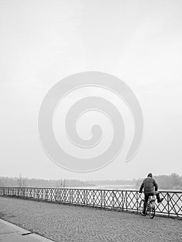 Man looking at the sea in a dull morning in winter