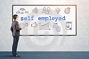 Man looking at self employed icons on whiteboard