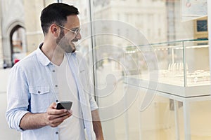 Man looking in the store window