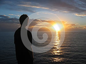 Man looking at sunset