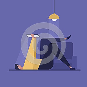 A relaxed man looking at tablet computer at home