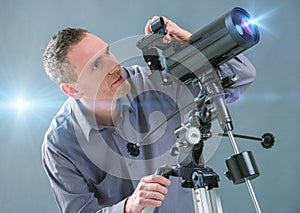 Man looking through telescope