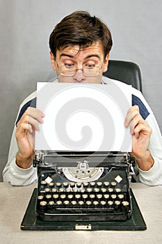 Man looking to blank sheet