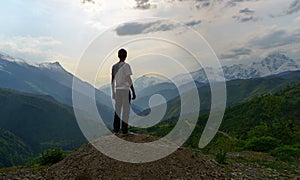 The man looking to the majestic mountais view