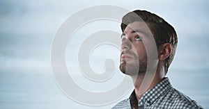 Man looking up with bright background