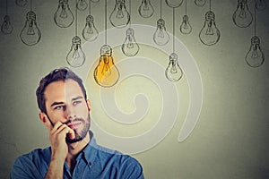 Man looking up with idea light bulb above head