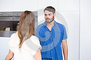 Man looking at wife while arguing