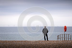 Man looking at windfarms at brighton