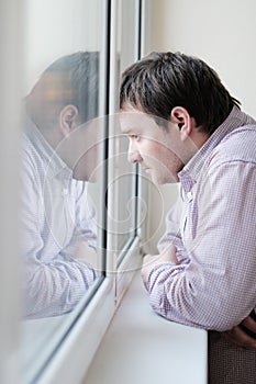 Man looking at the window