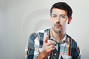 Man looking at you and point