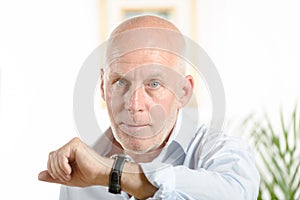 A man looks at his watch