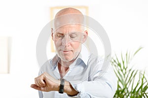 A man looks at his watch