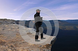 Man looks at the landscape from Lincoln Rock Lookout at sunrise