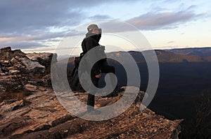 Man looks at the landscape from Lincoln Rock Lookout at sunrise