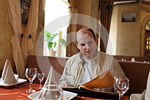 Man looks at menu